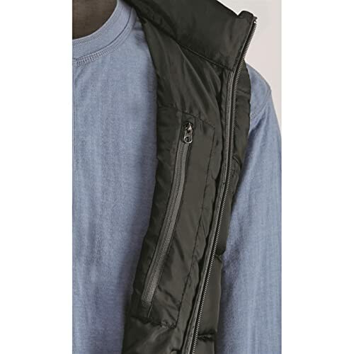 Close-up of a black puffer vest over a blue shirt