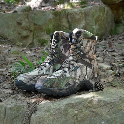 Camouflage hiking boots on rocks in a forest setting