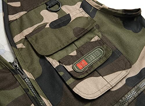 Close-up of camouflage vest with pocket and zipper