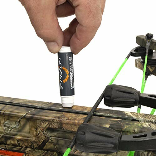 Hand applying lubricant to crossbow rail