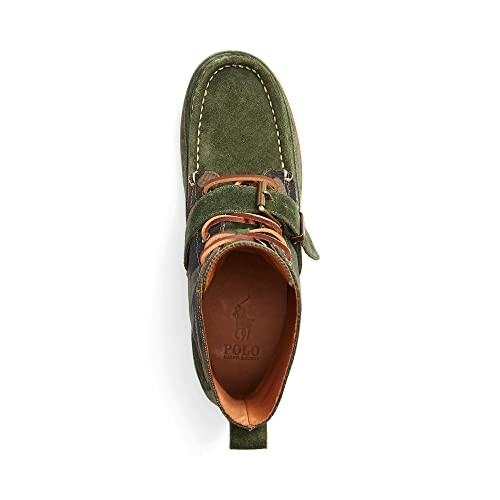 Top view of a green suede shoe with buckle detail.