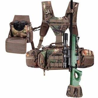 Camo hunting vest with rifle and binoculars attached.