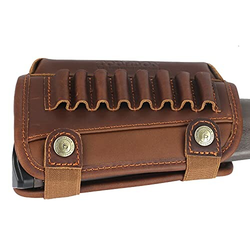 Leather rifle buttstock cover with ammo loops and brass buttons.