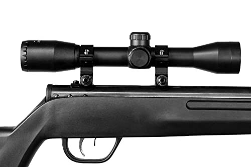 Rifle with mounted scope on a white background